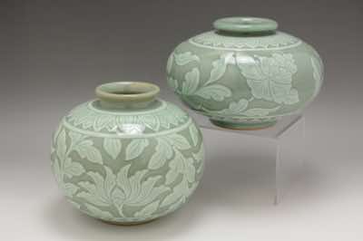 These vases were hand-thrown and hand-carved with floral patterns.  The patterns include peonies (two variations are shown), water lilies (not shown) and lotus flowers (not shown).  Shapes and sizes do vary; hence, none of them are identical.