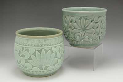 These planters were hand-thrown and hand-carved with water lilies.  Each is roughly 18cm in diameter and 15cm in height.