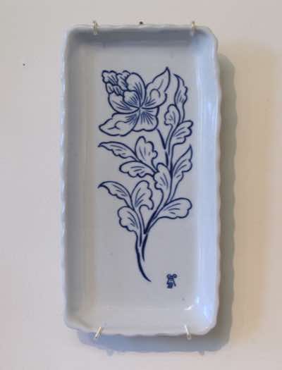 This serving plate was hand-built and hand-carved with peony using inlay carving technique (i.e. carve the outline of the pattern, fill carved area with cobalt blue colored slip and scrape off the excess slip).  It is roughly 15cm x 30cm with 3cm in heigh. 