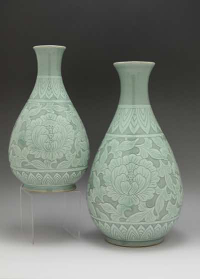 These vases were hand-thrown on a pottery wheel and hand-carved with another variation of peonies.  